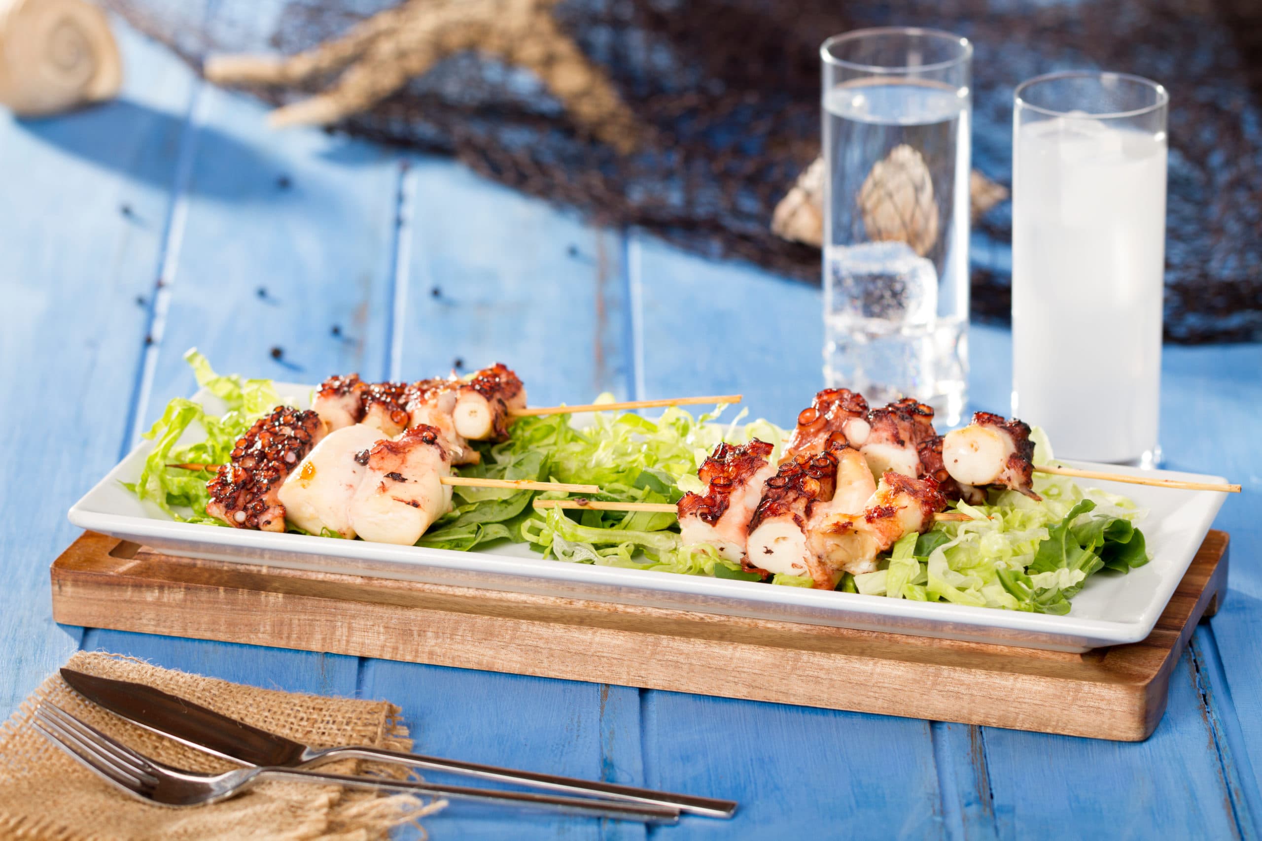 Delicious,Seafood,Octopus,Skewer,At,White,Plate,With,Lettuce,And