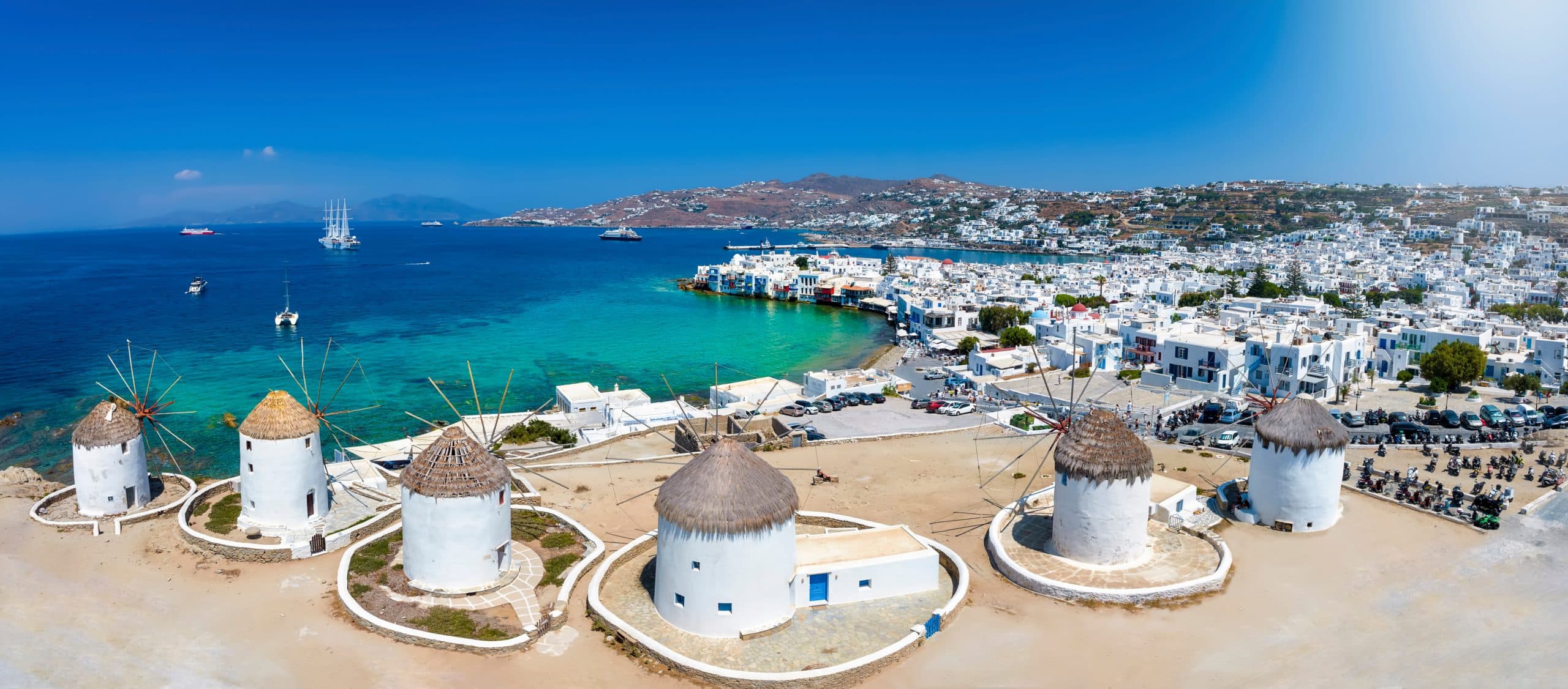 Panoramic,View,Through,The,Famous,Windmills,Above,Mykonos,Town,,Cyclades,
