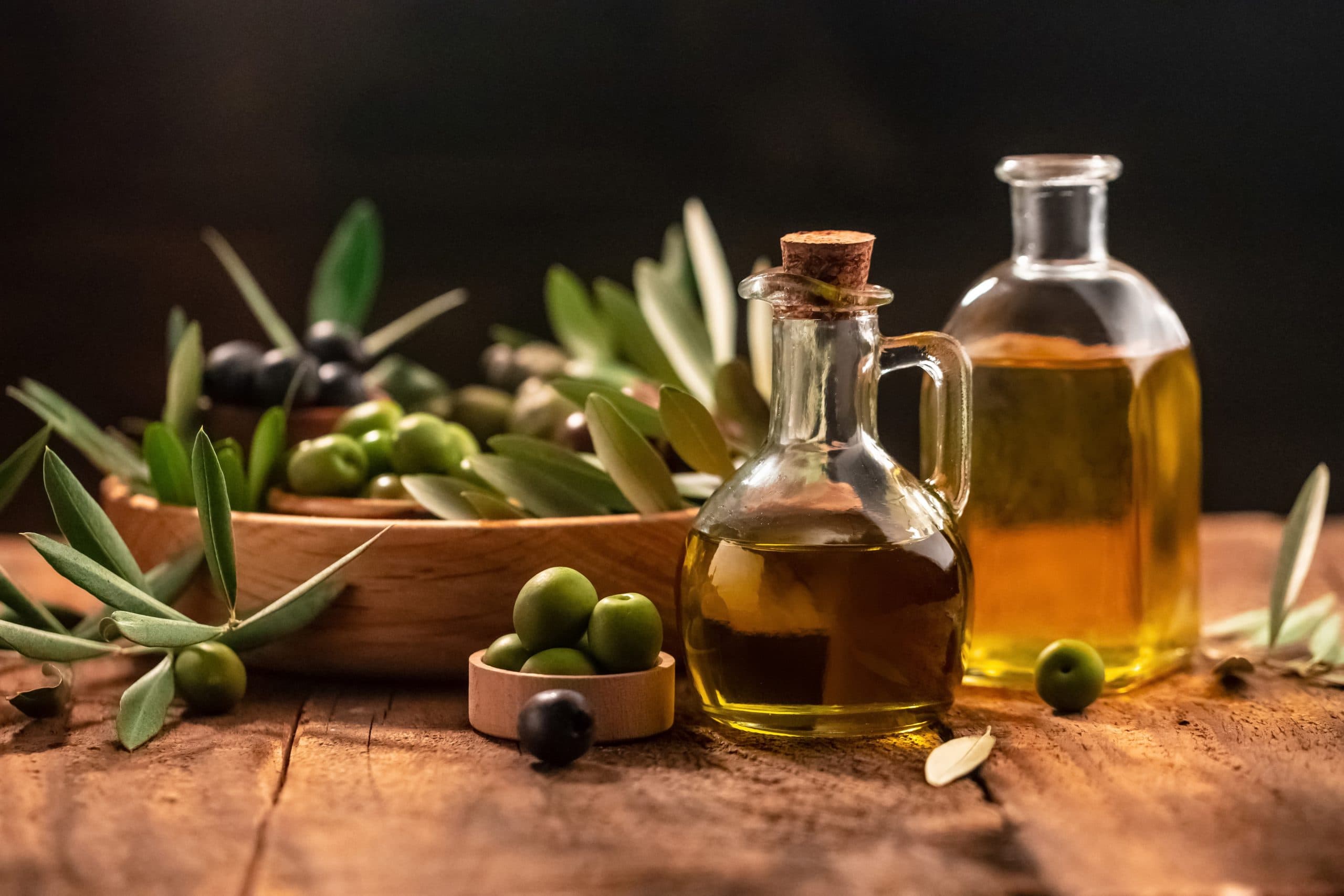 Olive,Oil,In,Bottles,With,Black,And,Green,Olives,And