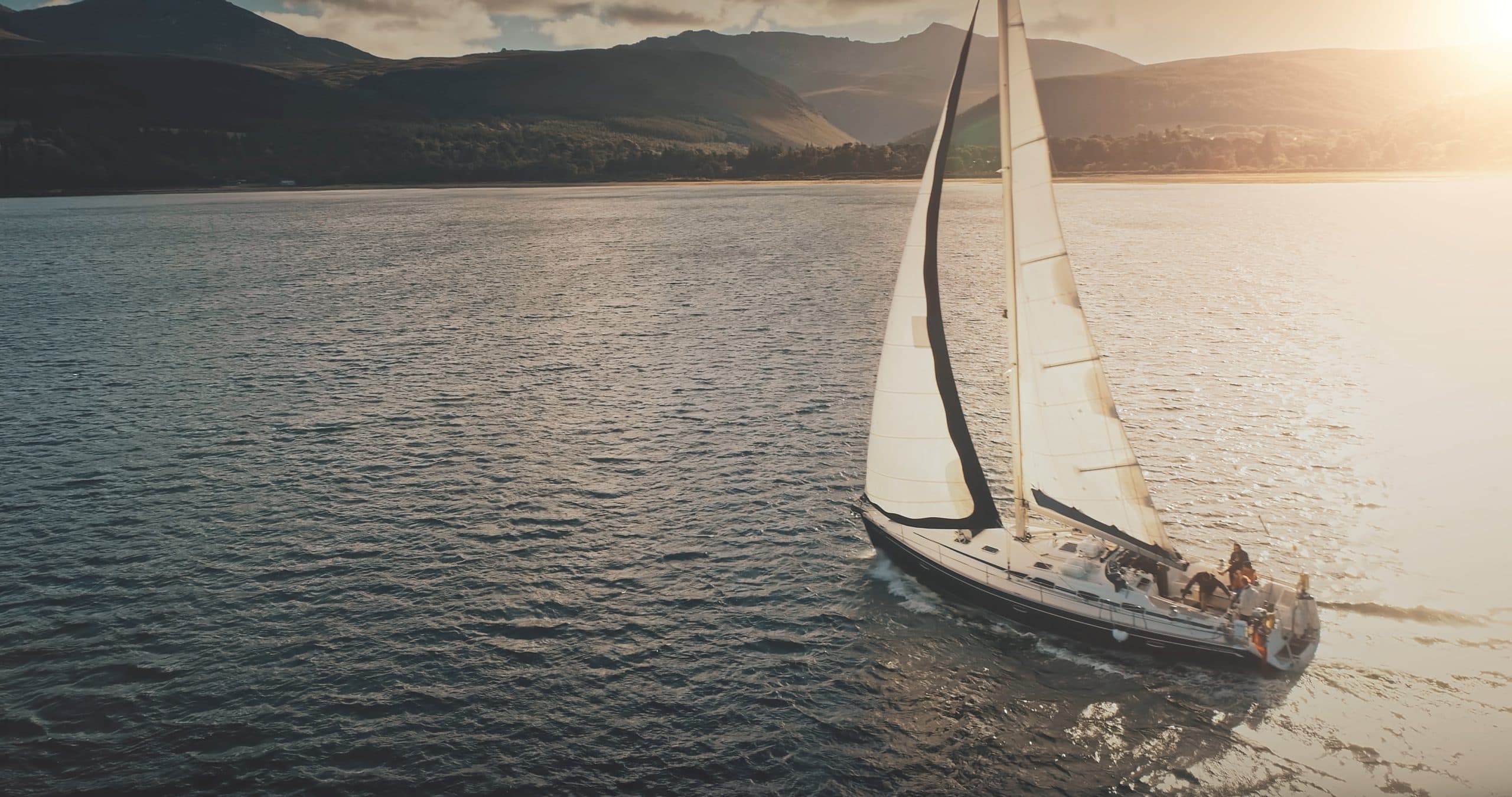 Sun,Shine,Over,Yacht,At,Mountain,Island,Coast,Aerial.,Luxury