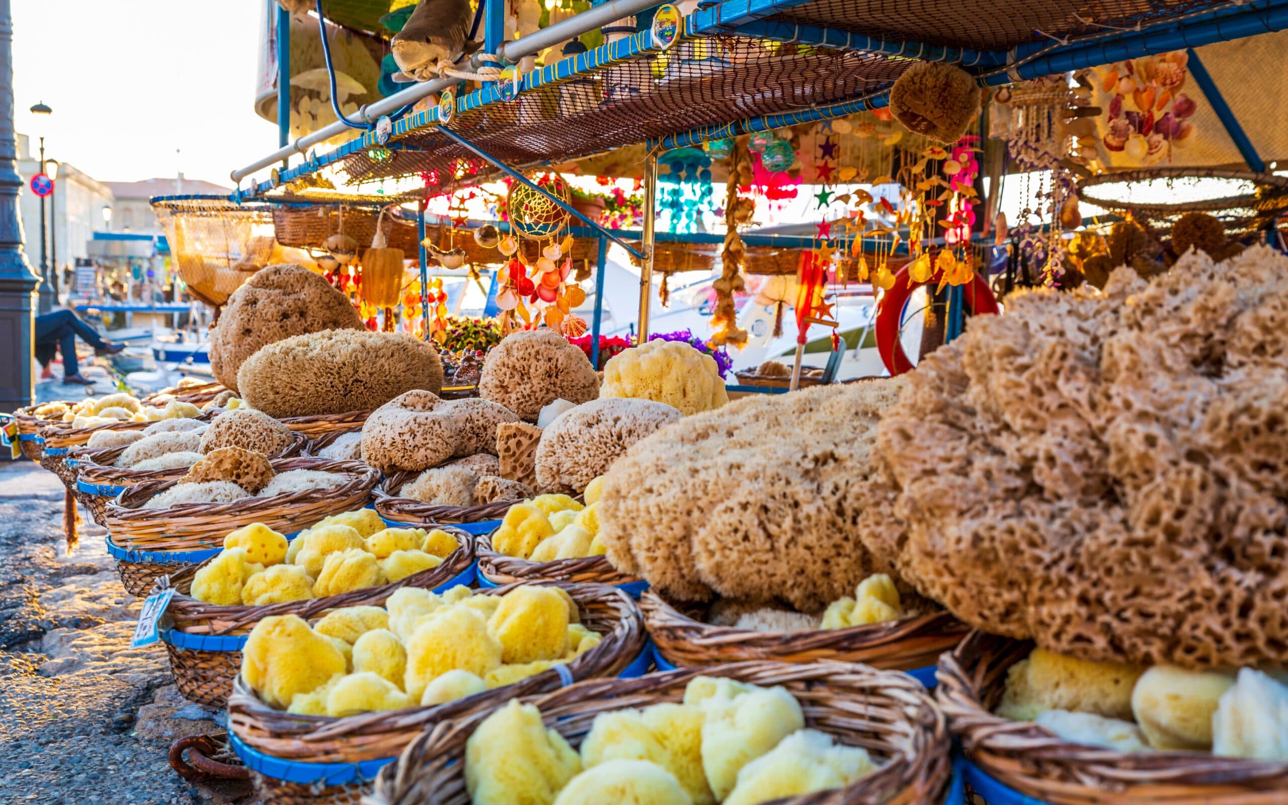 Souvenirs,And,Sea,Sponges,For,Sale,On,A,Boat,In