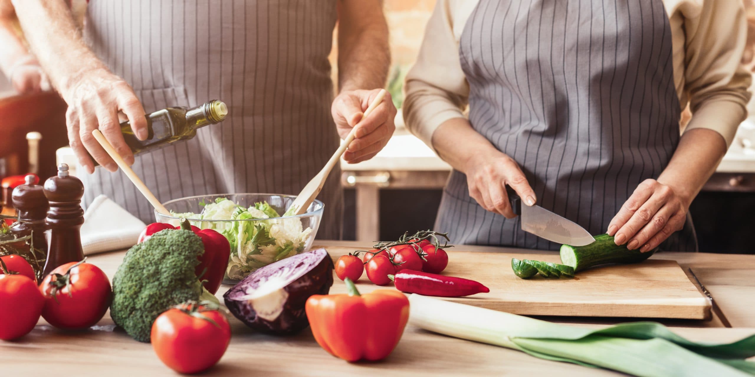 Cropped,Of,Older,Couple,Happily,Prepares,A,Meal,Together,In