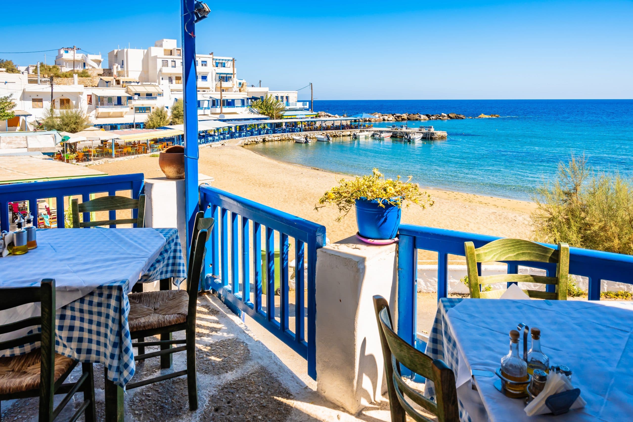 View,Of,Beach,From,Greek,Taverna,Restaurant,In,Apollonas,Village,