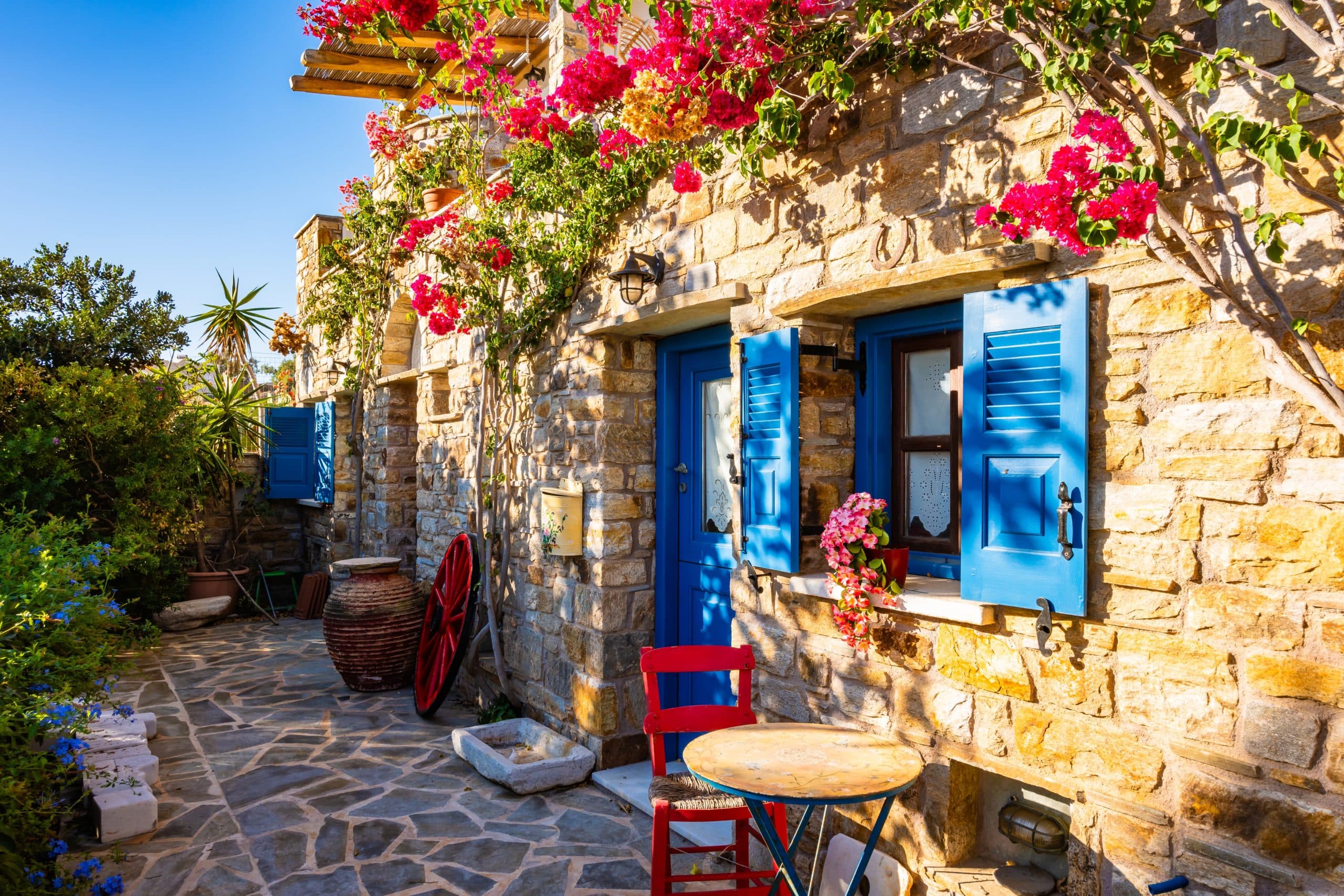 Typical,Greek,Style,Apartments,Decorated,With,Colorful,Flowers,In,Galini