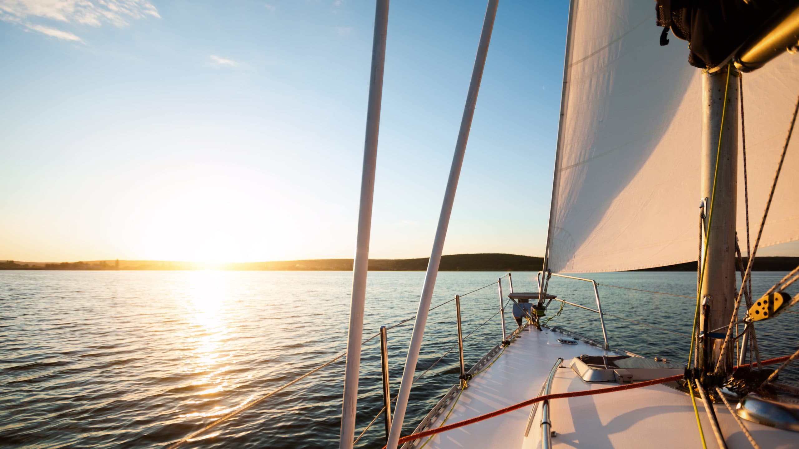 White,Yacht,Or,Catamaran,Sailboat,Sailing,In,The,Sea,On
