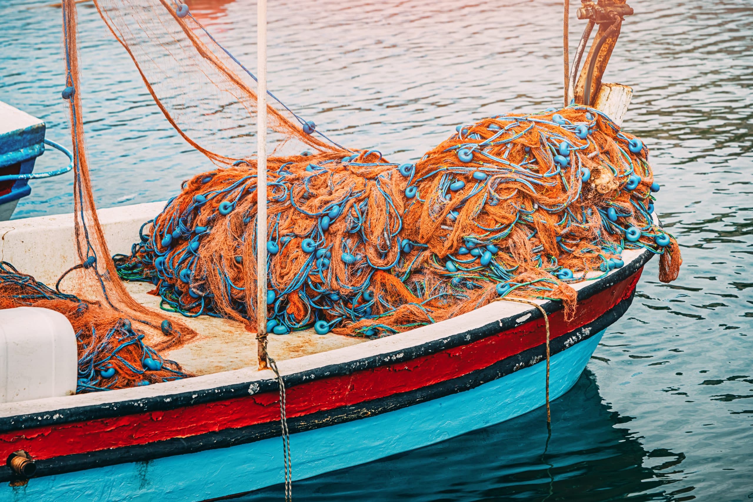 Fishing,Nets,With,Blue,Floats,Are,Lying,On,The,Bow