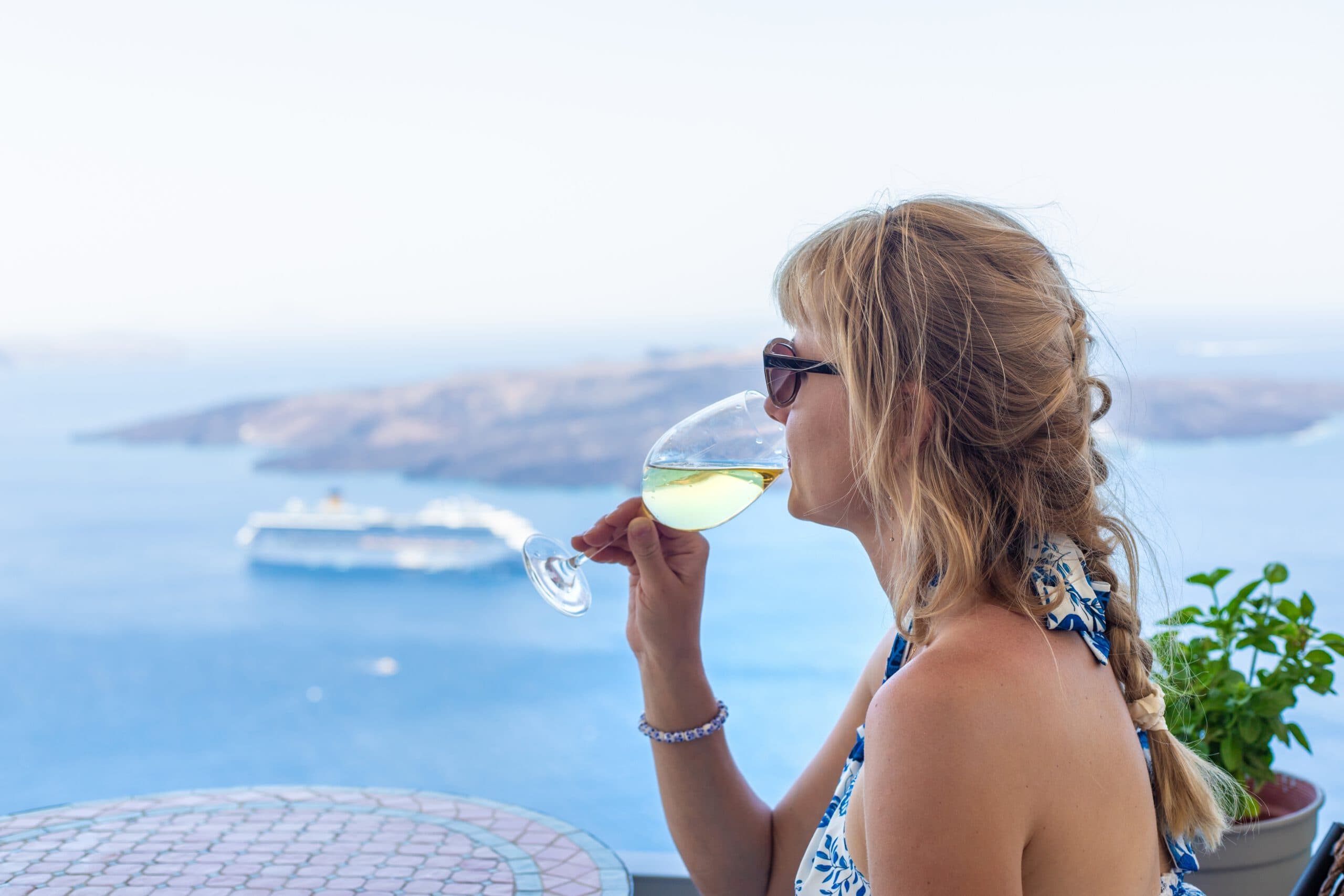 Woman,With,Glass,And,Wine,In,Greece,In,Restaurant.,Selective