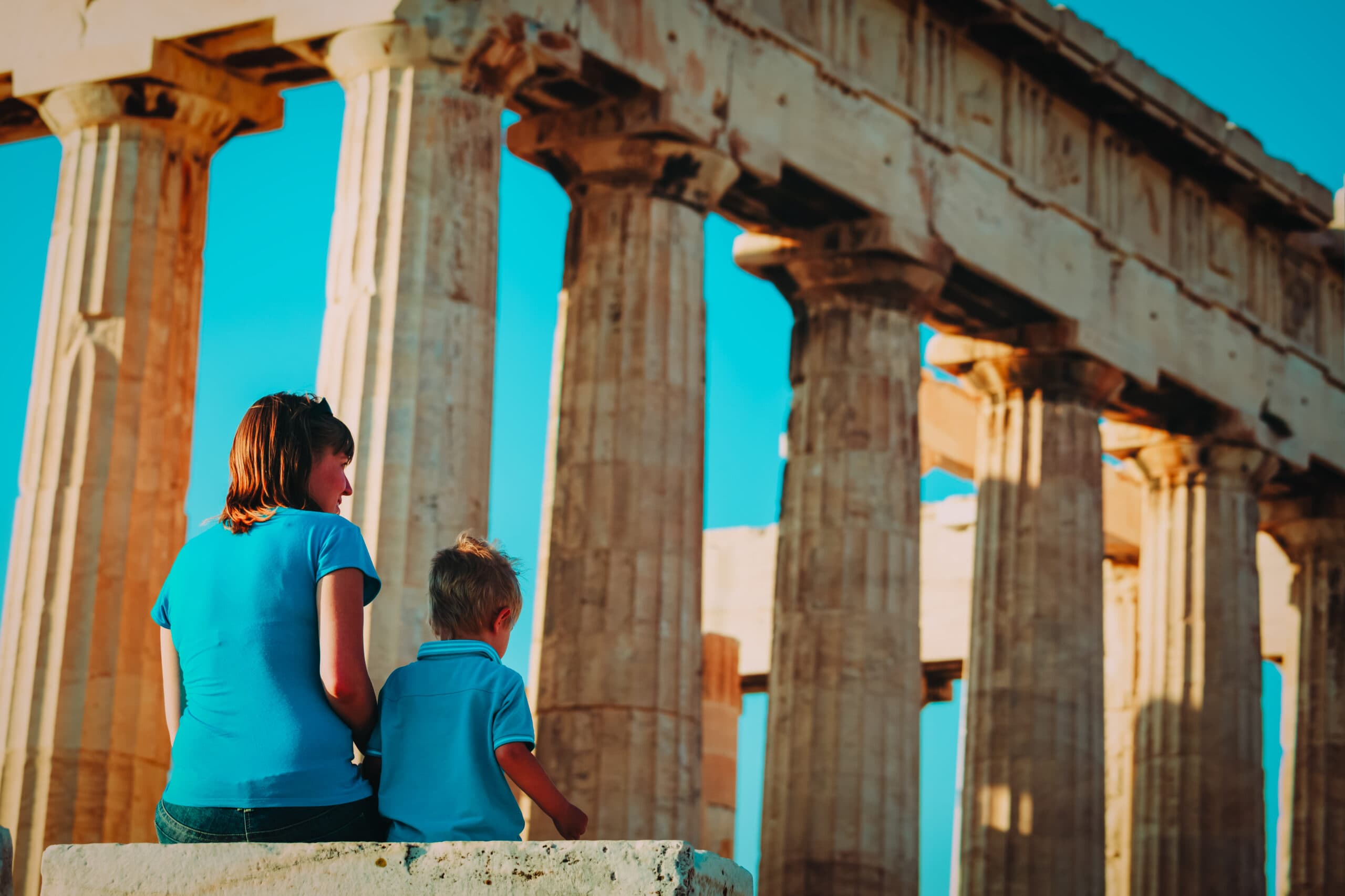 Mother,And,Son,Travel,In,Greece,,Lookint,At,Ancient,Buildings