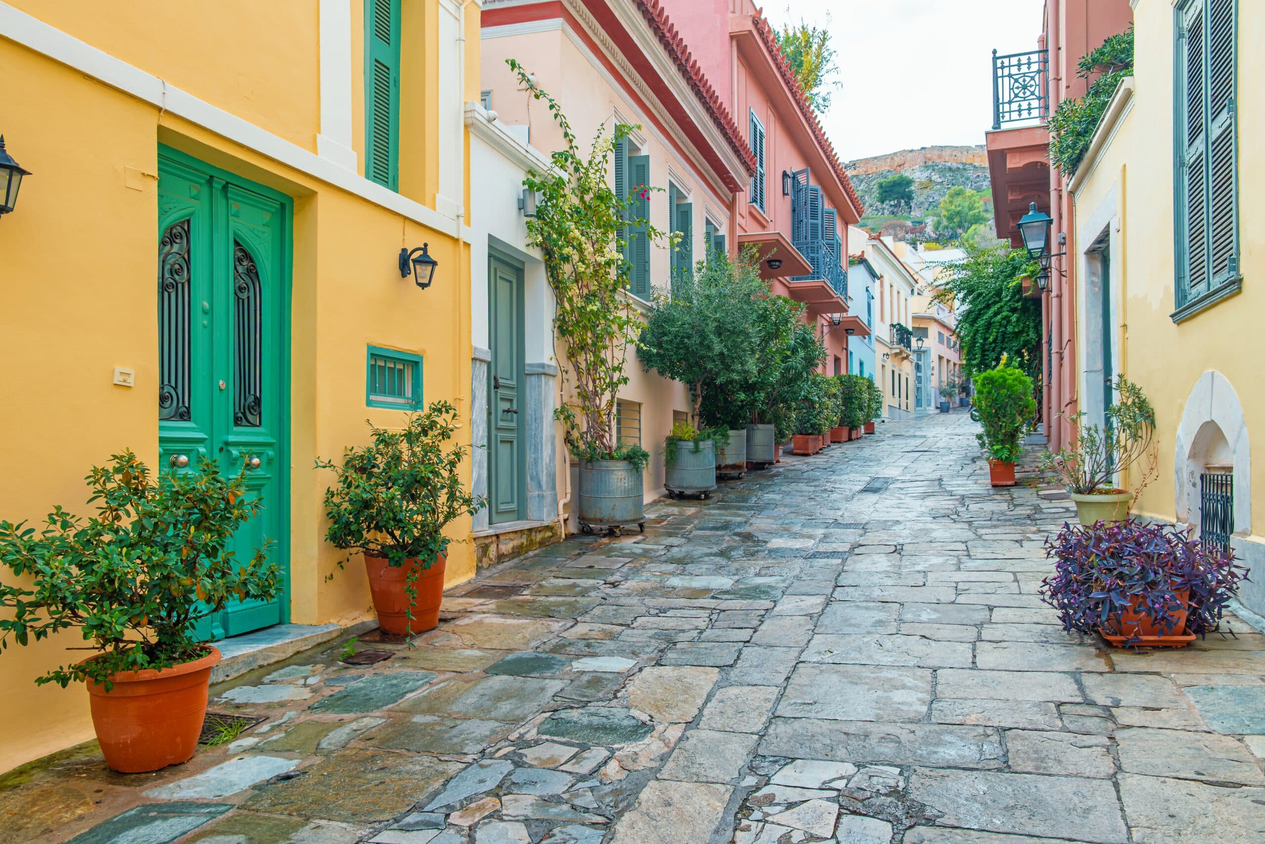 Stone,Paved,Street,With,Colorful,Traditional,Houses,,Green,Doors,And