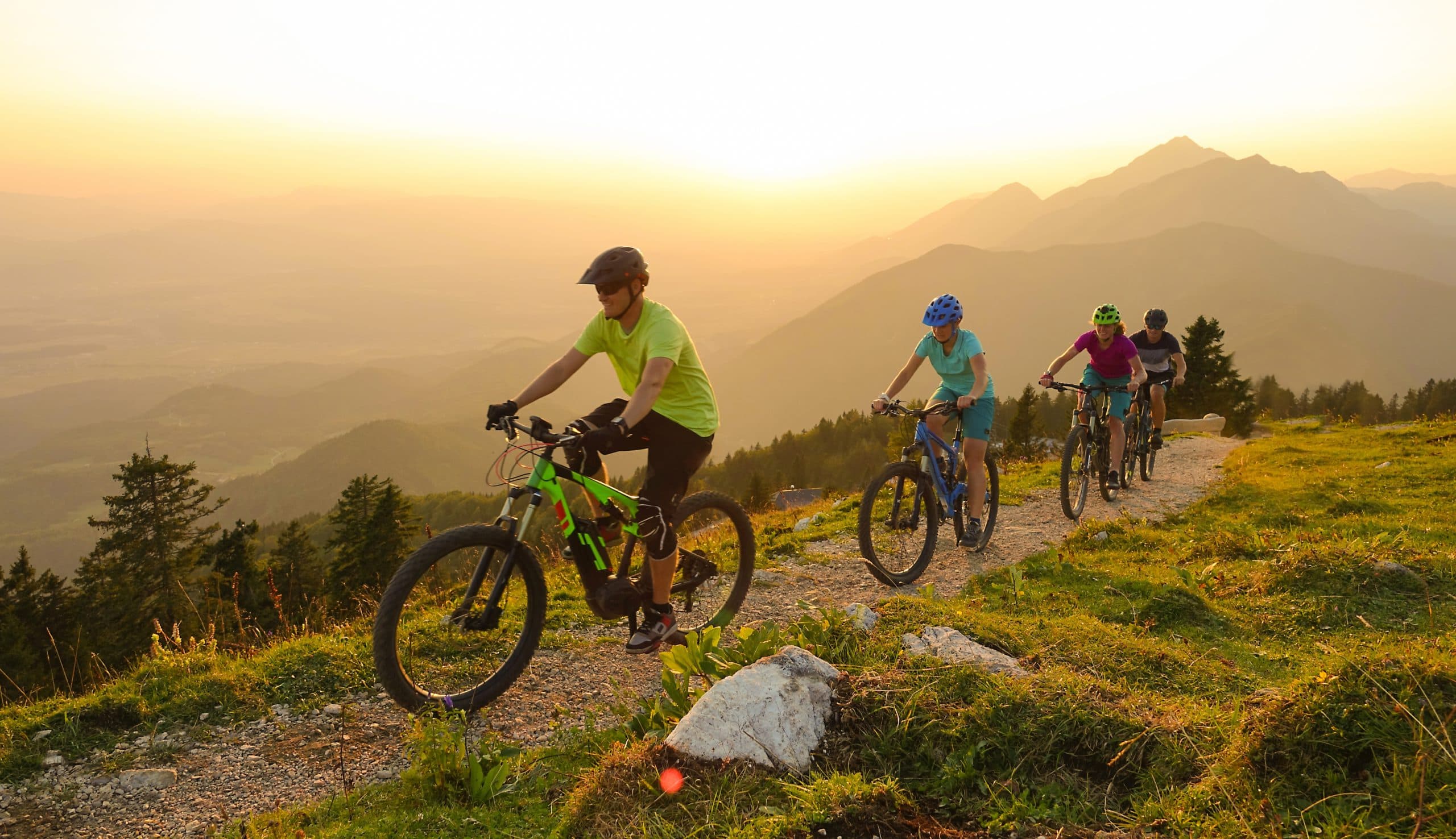 Sun,Flare:,Cheerful,Caucasian,Tourists,Ride,Electric,Bicycles,Up,A