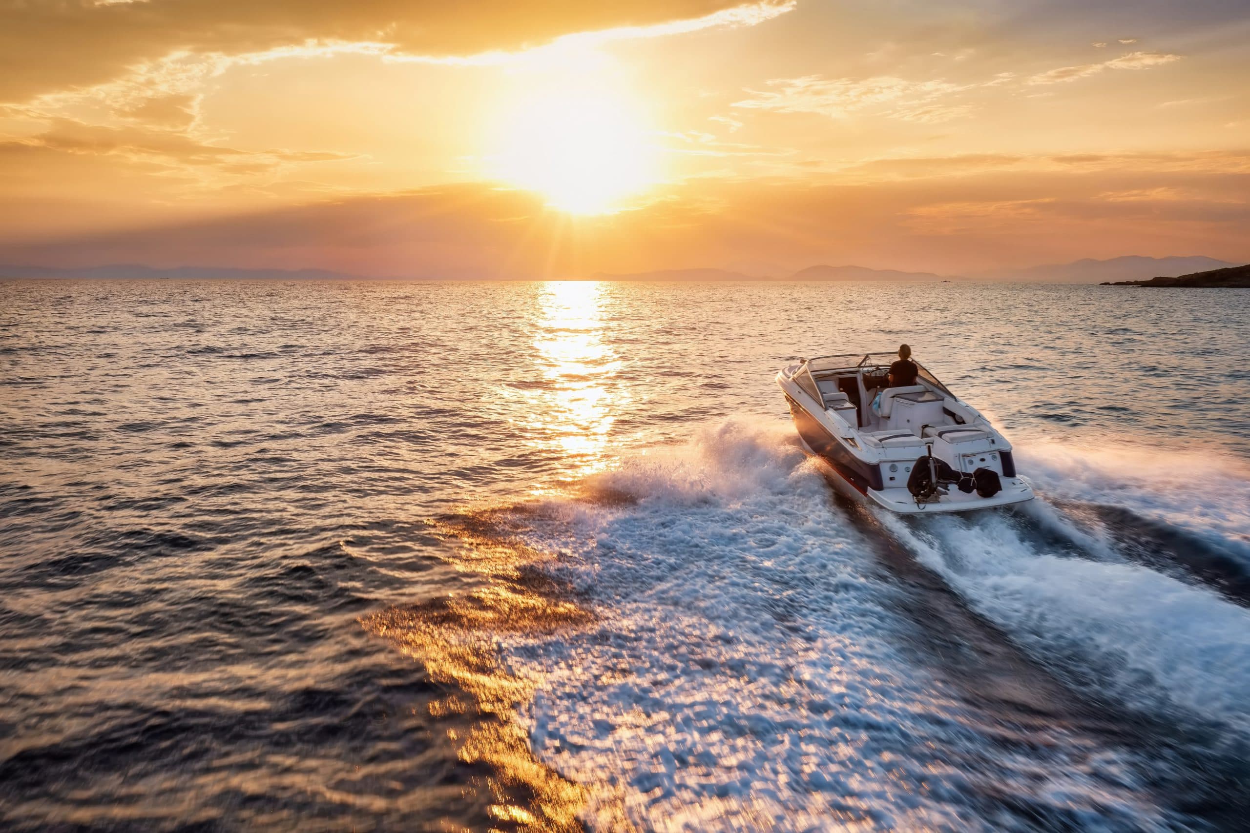 Aerial,Rear,View,Of,A,Sports,Motor,Boat,Cruising,With