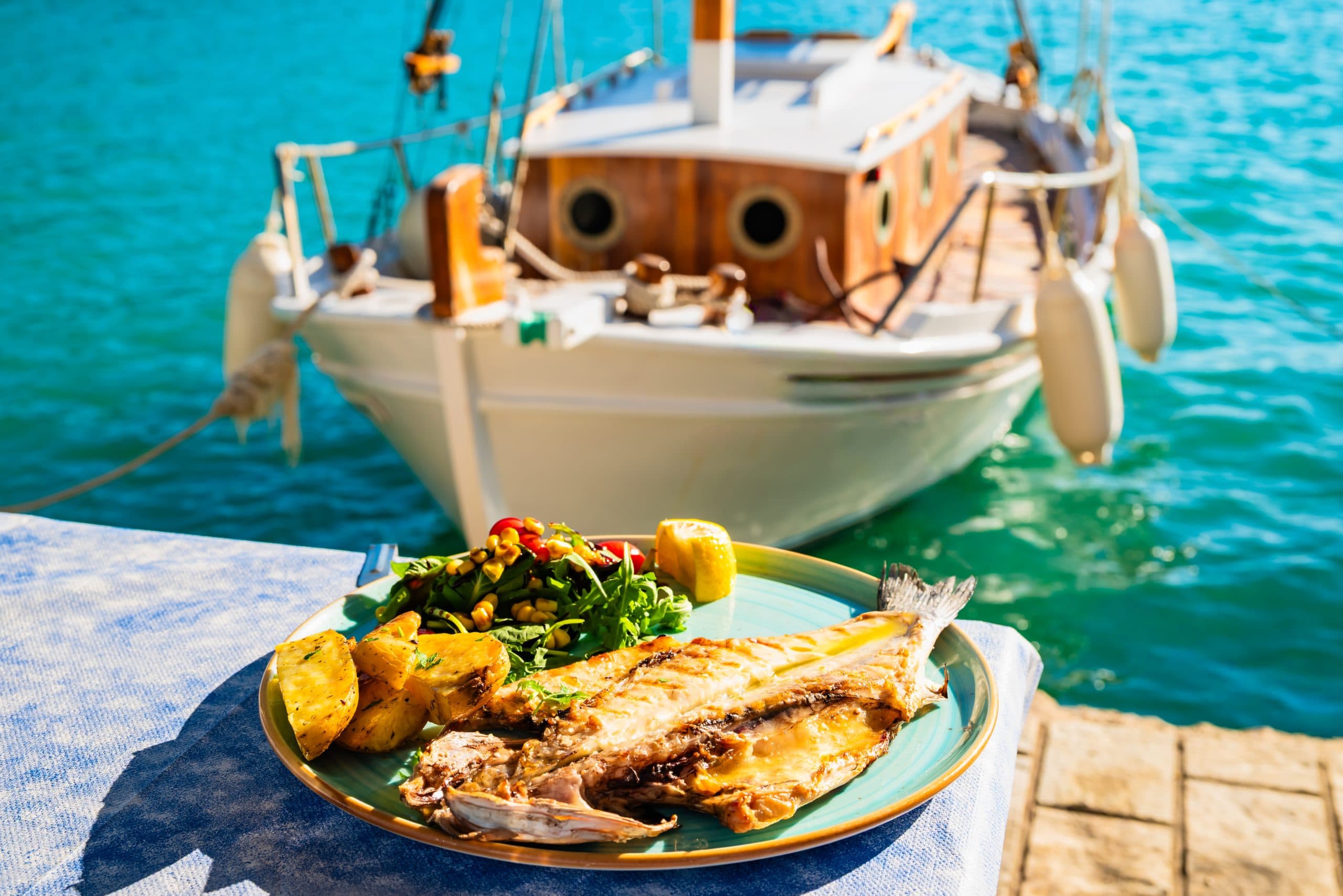 Freshly,Grilled,Fish,With,Potatoes,And,Salad,Served,By,The